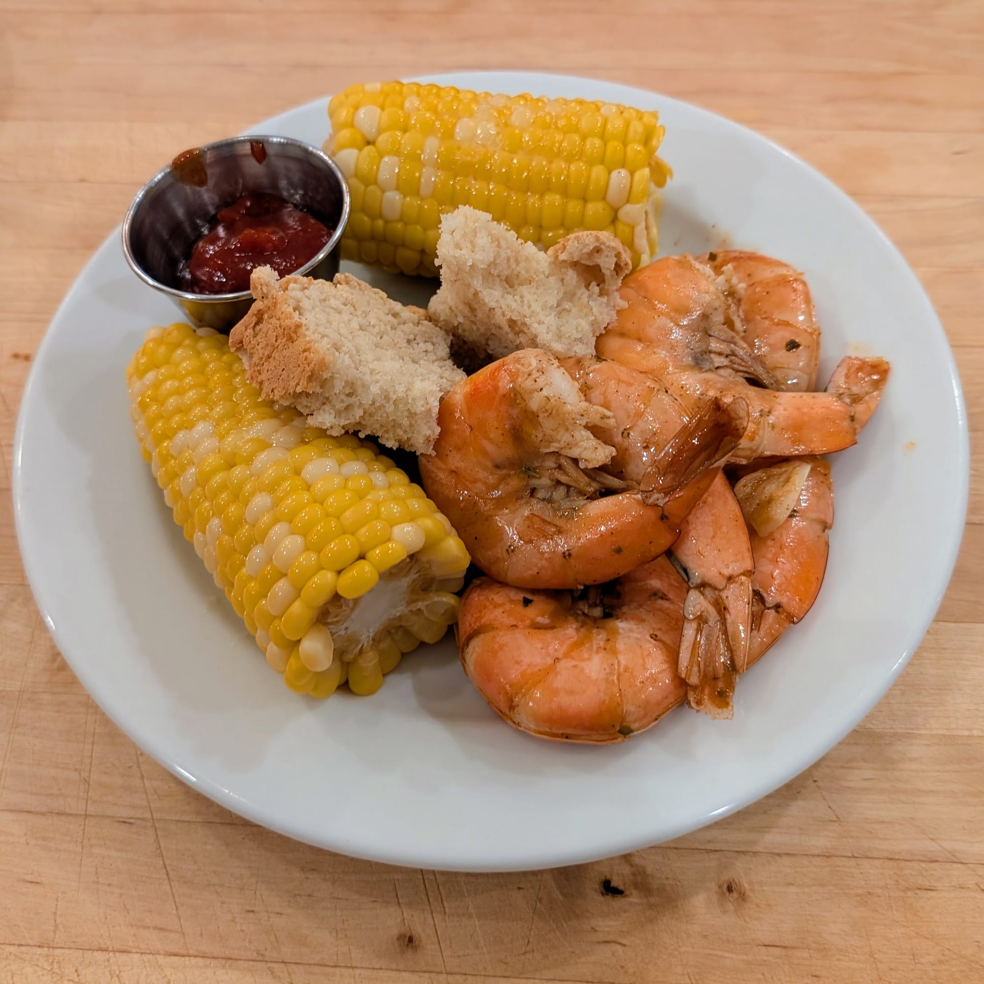 All plated and ready for some eatin'. Cajun Shrimps and Shrimp Cocktail Sauce. Sides of corn and Arva Flour Mills® Beer Bread. Fantastic.