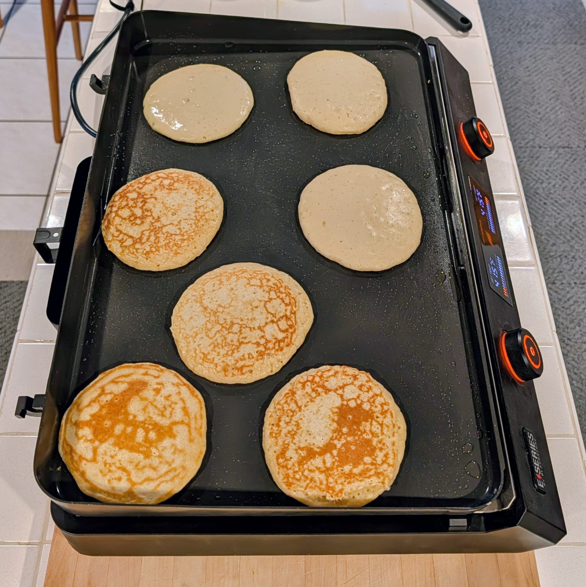 Cooking action shot.  Pancakes cooking nicely on the electric griddle.