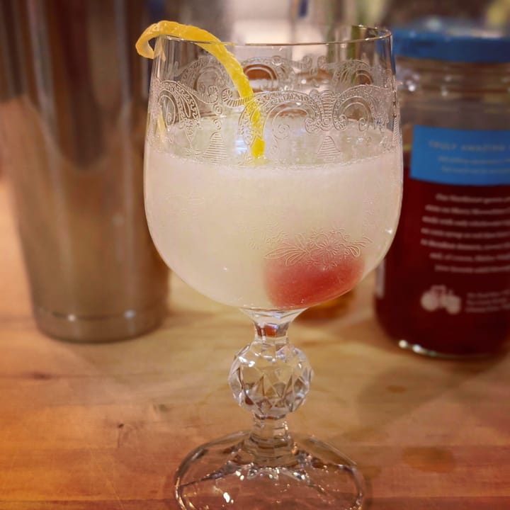 Casino cocktail in front of shaker.