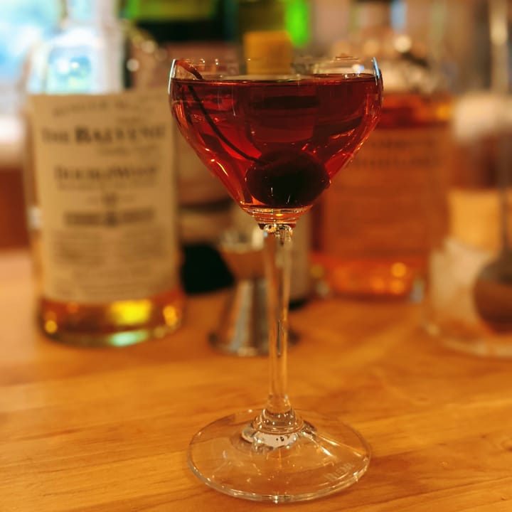 A Nick and Nora glass with an original cocktail that makes you love Pointers more.