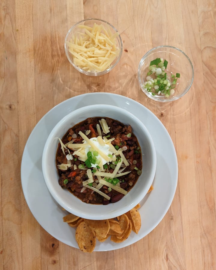 A nice serving of Beef Bean Chili with some Fritos® Original Corn Chips for a side.