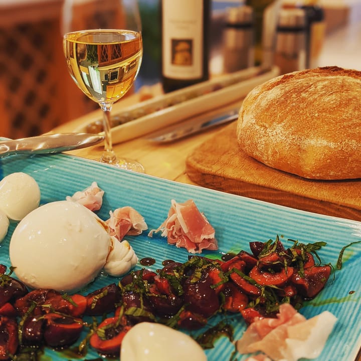 A nice appetizer platter featuring Burrata with Balsamic Cherries and Basil. Yummy.