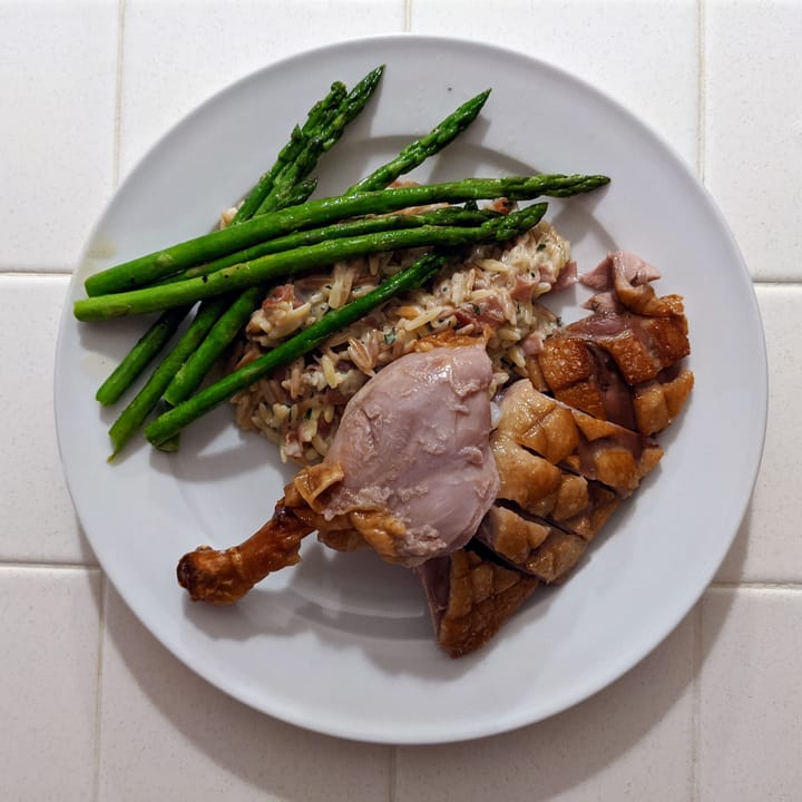 A plated Roast Duck with my Fancy Mac and Cheese and asparagus.