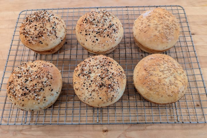 6 ginormous Hamburger Potato Buns. Four with everything bagel seasoning and two with sesame seeds.