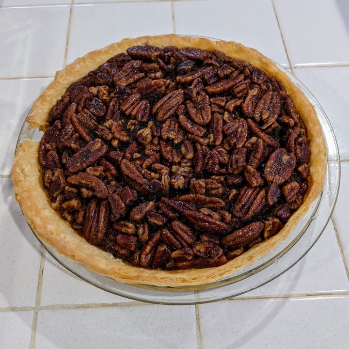 There is nothing more beautiful then a freshly baked Molasses Pecan Pie waiting to be eaten... maybe the empty plate after?   I'll let you decide.